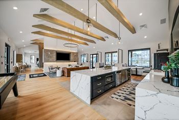 The kitchen is open to the living room and dining room